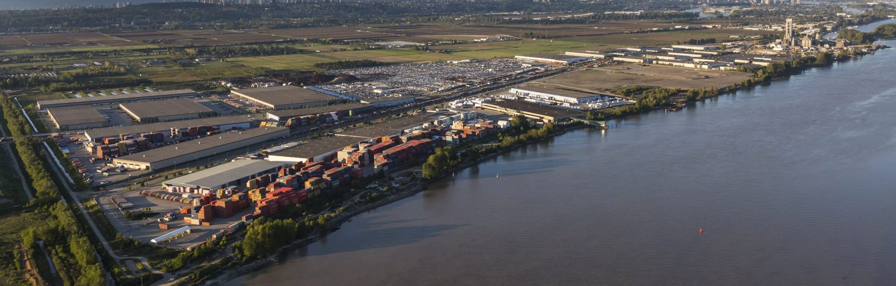 An industrial area sits on the banks of the river